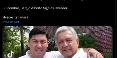 Hombre que abraza a AMLO