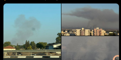 smoke above Tel Aviv buildings